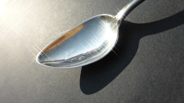Image of a shiny, possibly silver, spoon.